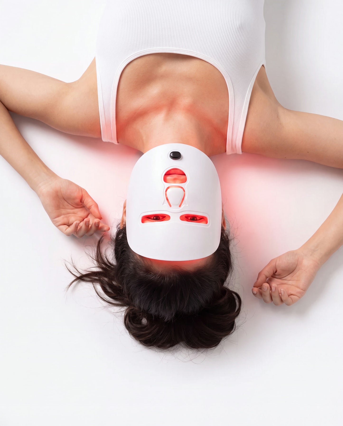 Woman wearing the Lumière LED mask during a session